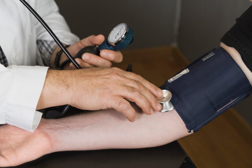 doctor-checking-blood-pressure_23-2147612162